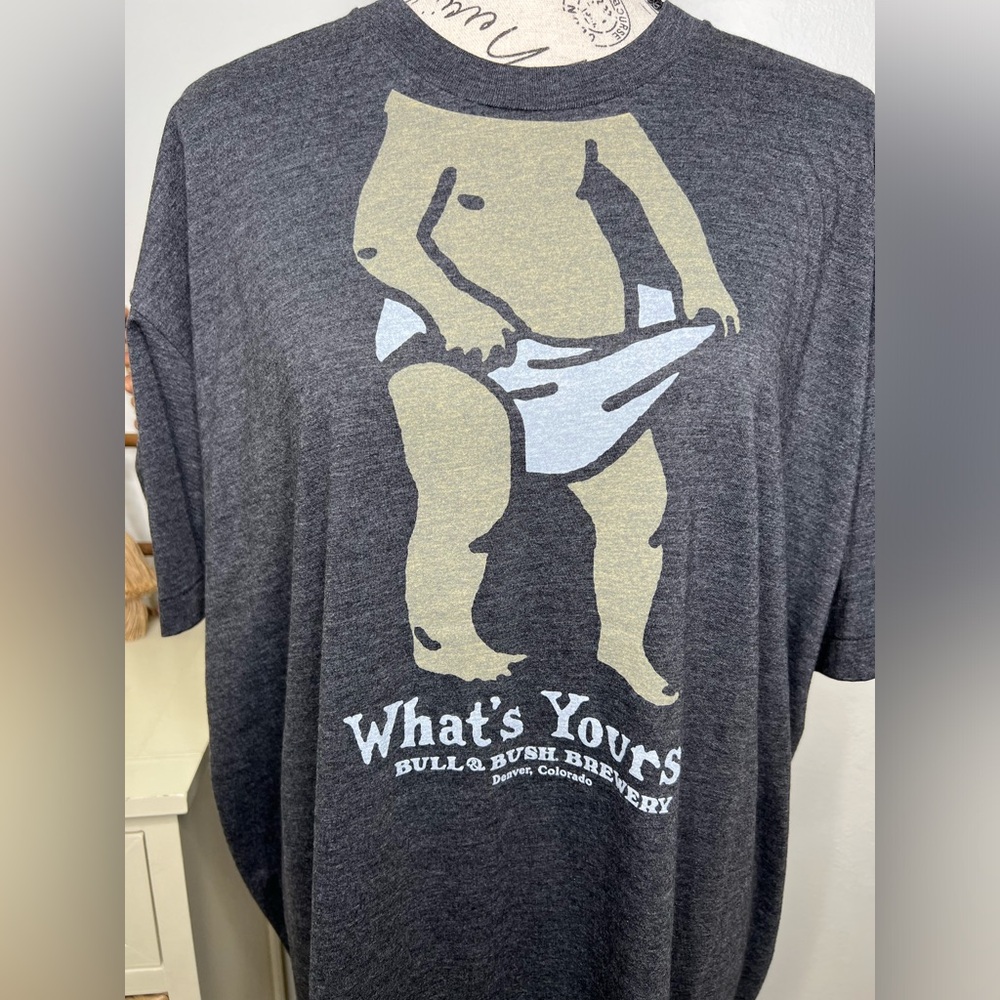 Brand New-“What’s Yours” Bull & Bush Tee